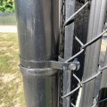 Chain Link Fence 47" High Black Tension Bar for 4' Fences (Pressed Steel) - Shown Installed On Chain Link Fence
