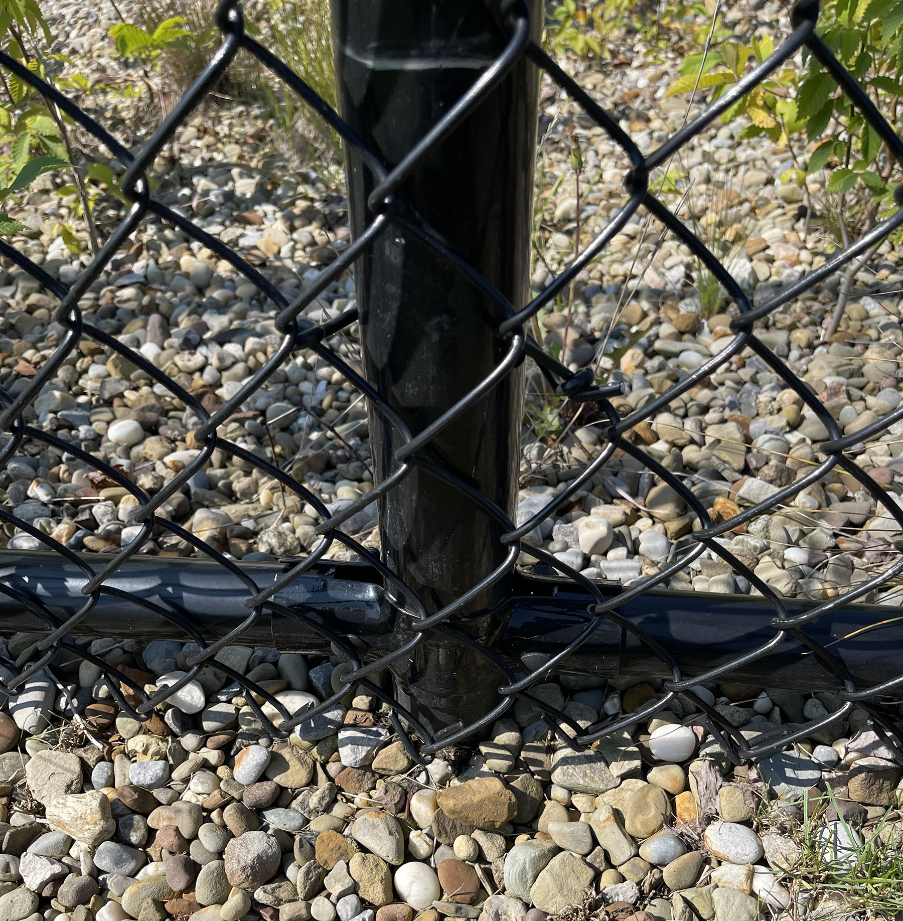 black chain link fence posts