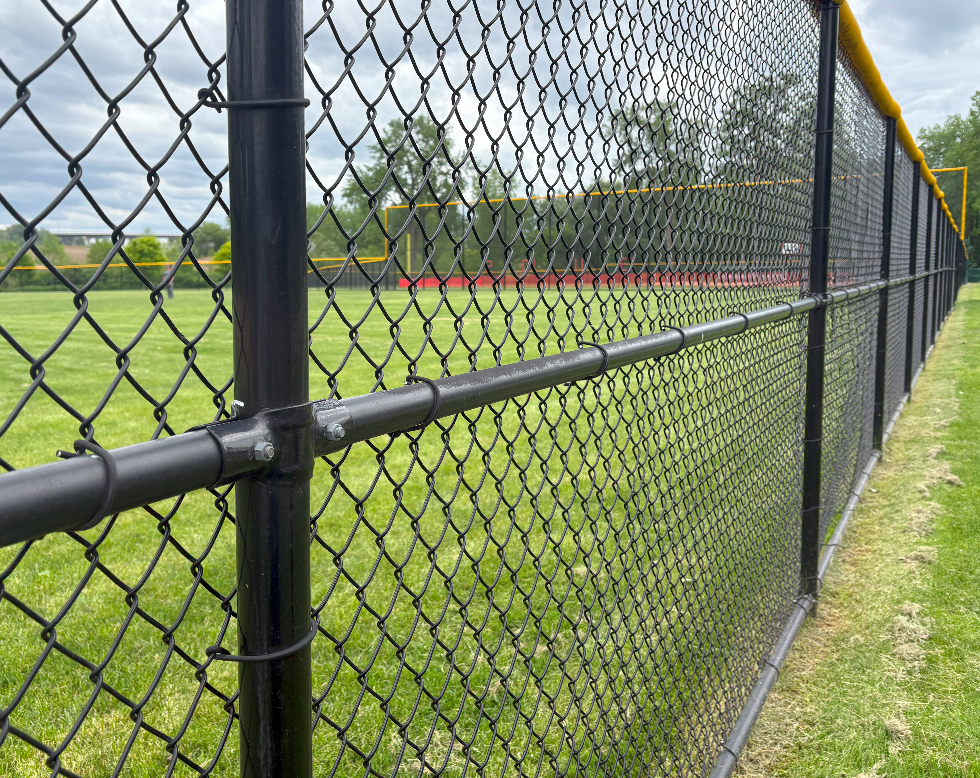 black chain link fence tension band installation