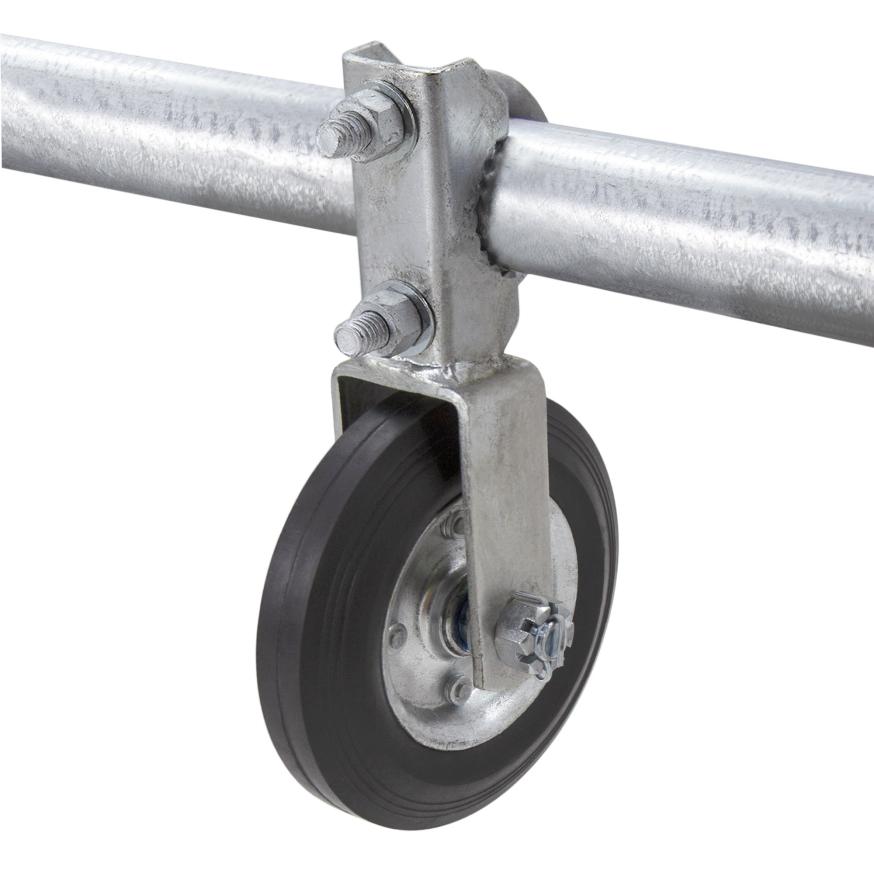 A wheel on a chain link fence