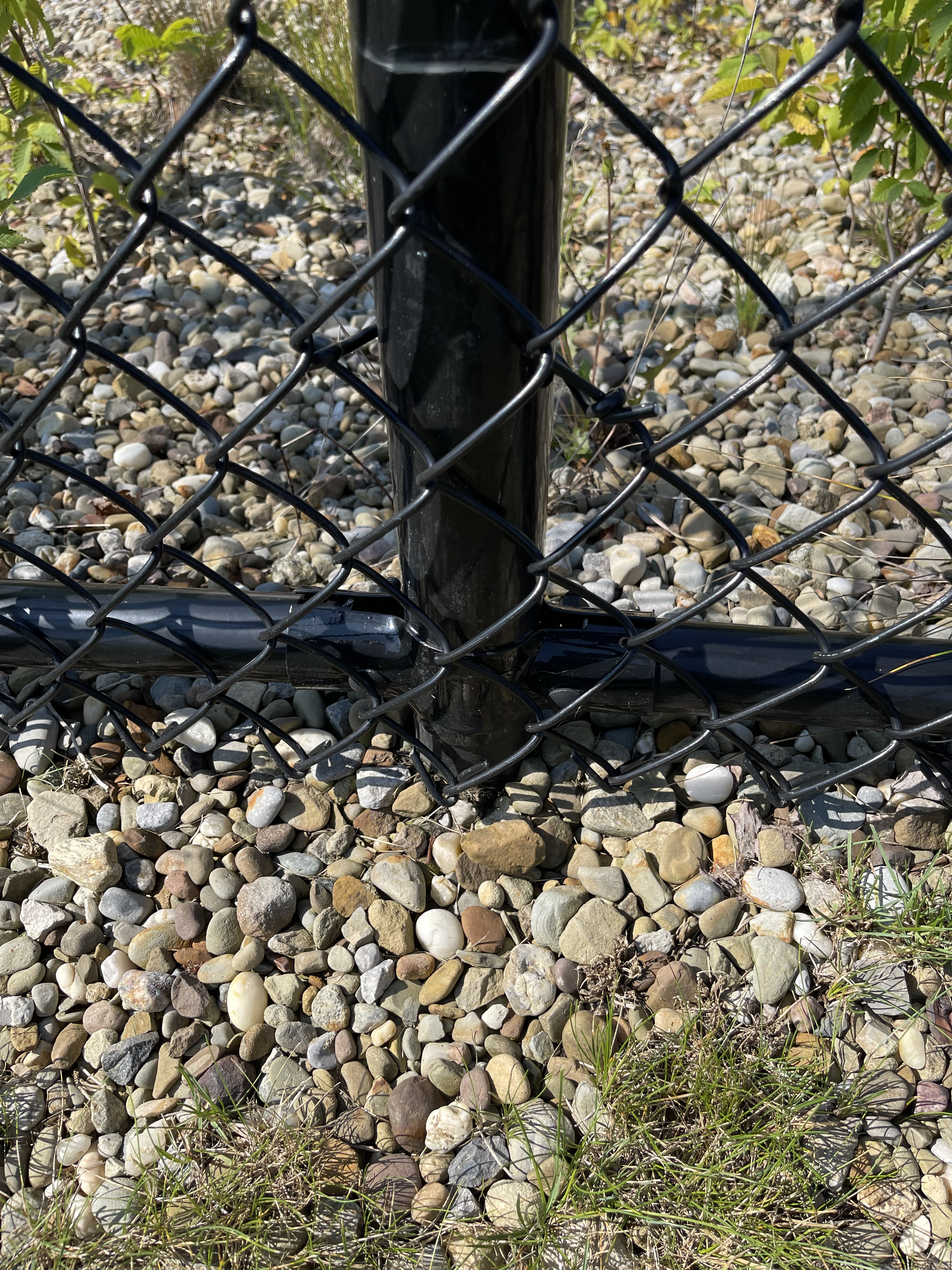 Bottom Of All Black Chain Link Fence